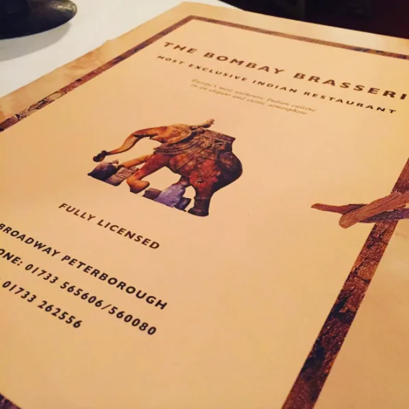 The Bombay Brasserie printed menu card with elephant logo